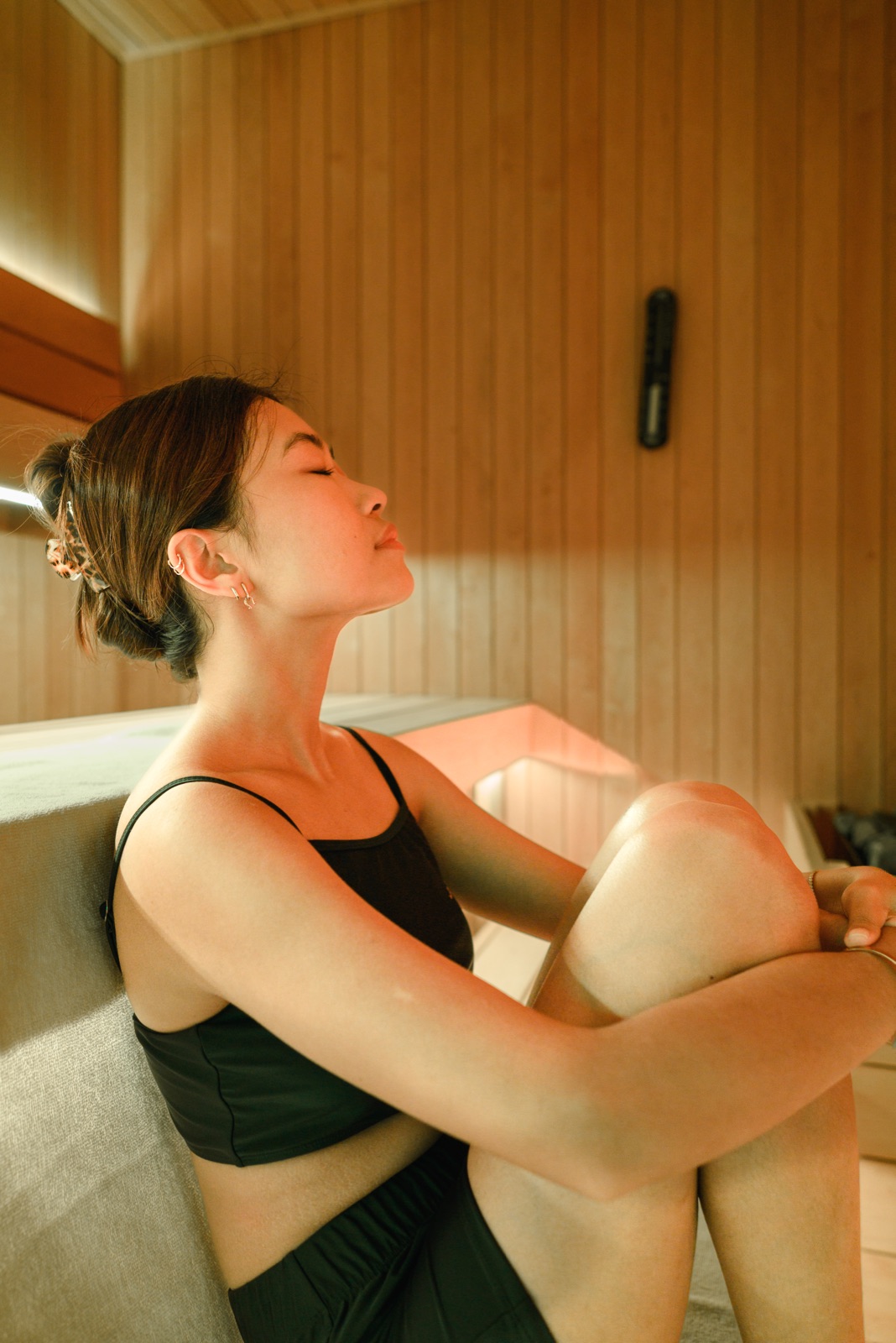 A guest relaxing in the warm dry sauna
