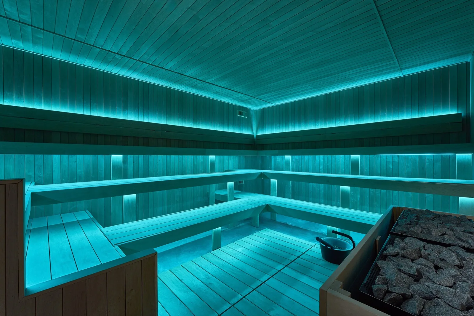 Guests pausing together inside the dry sauna
